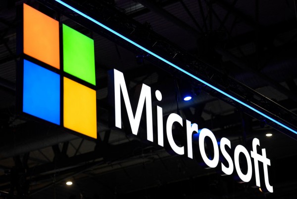 A Microsoft logo is displayed at the MWC (Mobile World Congress) in Barcelona on March 2, 2022. - The Mobile World Congress, where smartphone and telecoms companies show off their latest products and reveal their strategic visions, is expected to welcome more than 40,000 guests over its four-day run. (Photo by Josep LAGO / AFP)